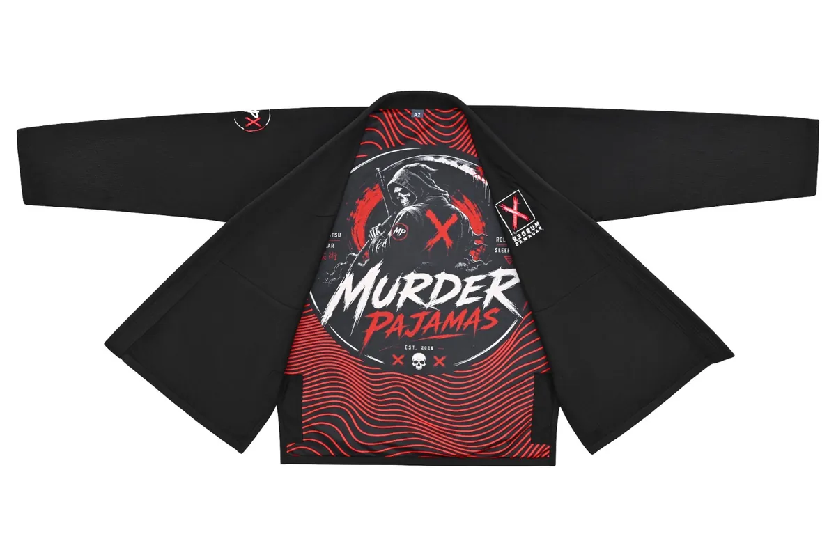 Black Murder Pajamas gi jacket laid open showing the full red and black striped lining