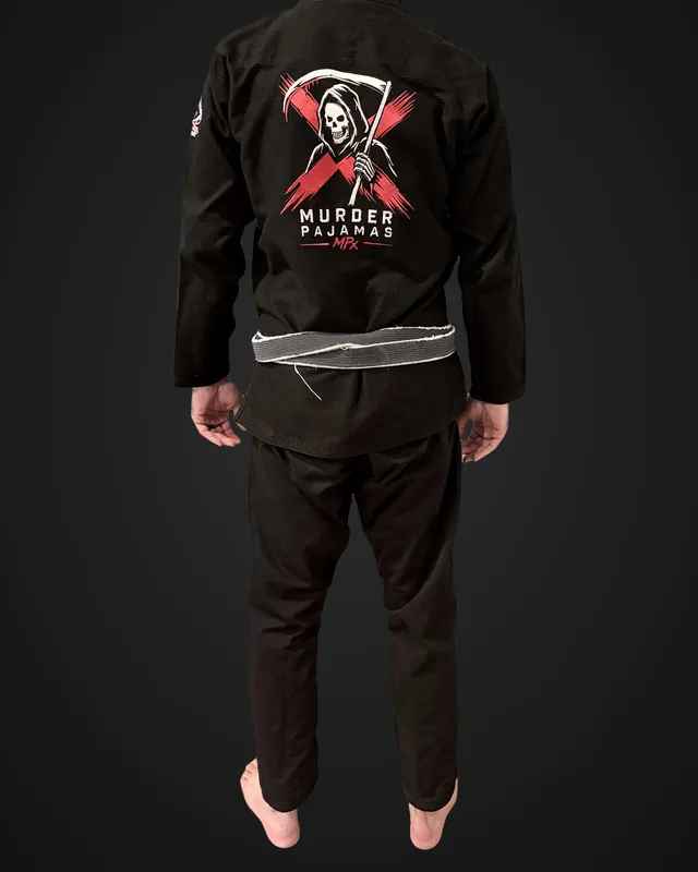 Back of Brent's black Murder Pajamas gi after 20 wash and dry cycles, showing the embroidered back art and MPx wordmark