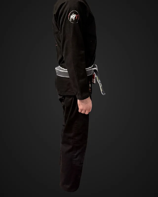 Side view of Brent's black Murder Pajamas gi after 20 wash and dry cycles, with the MPx shoulder patch