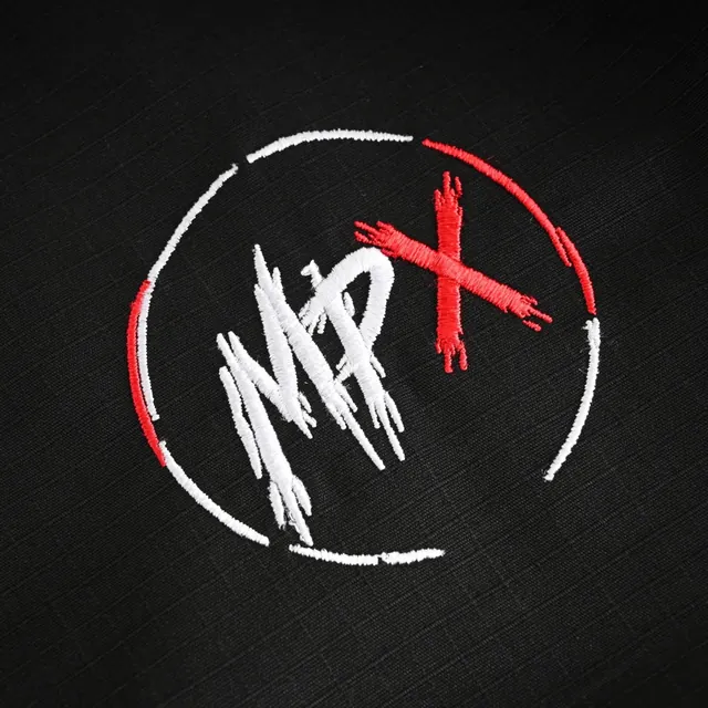 Embroidered MPx circle logo on the black gi sleeve