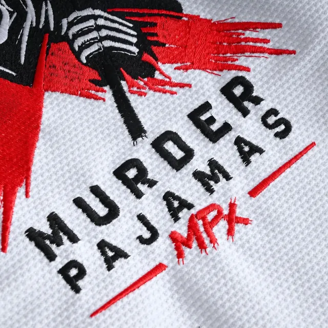 Embroidered back art on the white gi: MURDER PAJAMAS MPx in black and red under the skeleton and scythe
