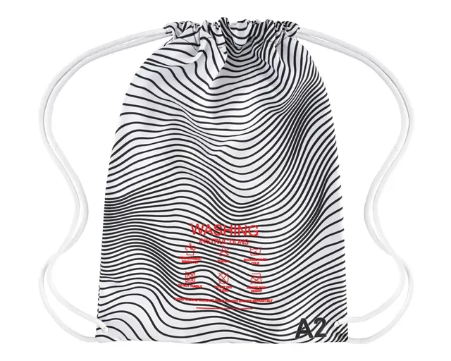 Back of the black and white Murder Pajamas gi bag with printed wash instructions and A2 size