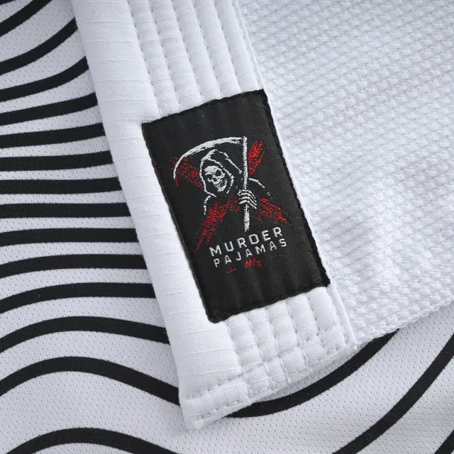Skeleton label on the black and white wave stripe lining inside the white gi