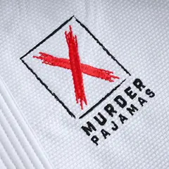 Embroidered red X and MURDER PAJAMAS logo on the white gi jacket skirt